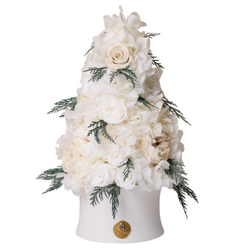 Floral arrangement in a white vase on a white background
